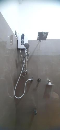 a room with a glass table with a cell phone on it at Anuradhapura Kingdom View Resort in Anuradhapura