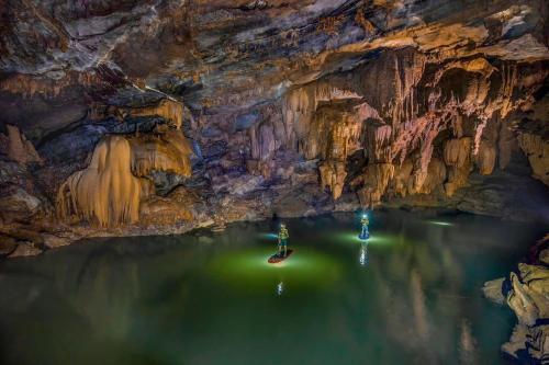 a boat in the water in a cave at Phong Nha Dawn Home in Phong Nha