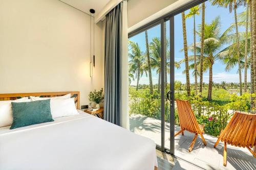 Ένα ή περισσότερα κρεβάτια σε δωμάτιο στο May Villa Hoi An-4Brs