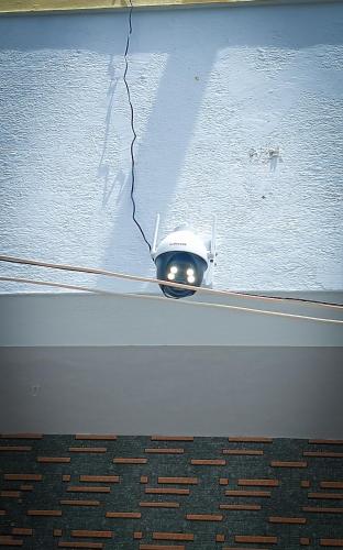 a small white object on the side of a wall at Jas Homestay Madurai in Tirupparangunram