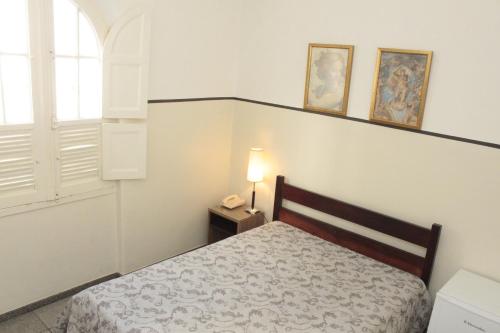 Cama ou camas em um quarto em Sul América Palace Hotel