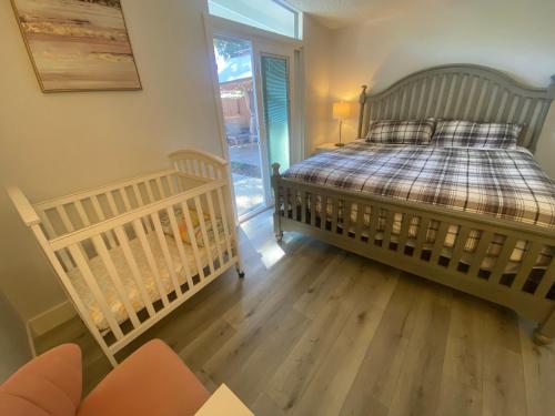 a bedroom with a bed and a sliding glass door at NEW cozy beautiful house with pool and hot tub in Fair Oaks
