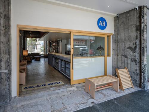 an entrance to an arctic north kitchen with glass doors at Arcade Hotel in Fuji