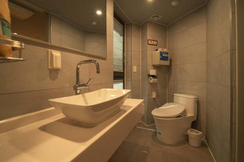 a bathroom with a sink and a toilet at Shinchon Maven Hotel in Seoul