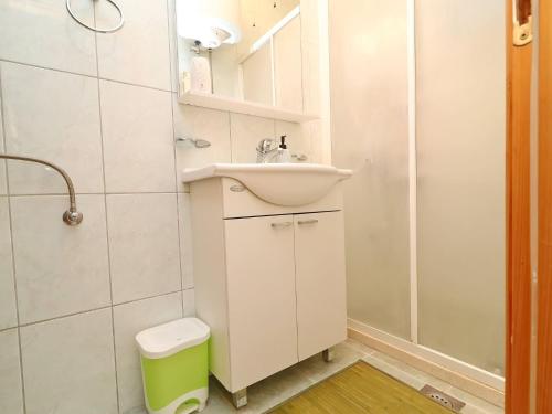 a bathroom with a sink and a toilet and a shower at Apartments K & N -One Bedroom Apartment in Prizba