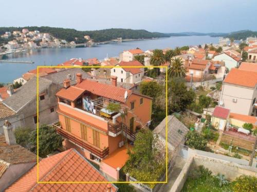 an aerial view of a town with houses and a river at Apartment Blamax with Terrace and Sea View in Mali Lošinj