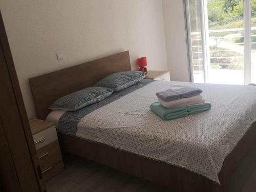 Un pat sau paturi într-o cameră la Apartments Kalajzic- Two Bedroom Apartment with Terrace A4 ST