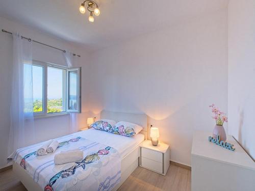 Postel nebo postele na pokoji v ubytování Apartments Grljevi - One Bedroom Apartment with Balcony and Sea View A4
