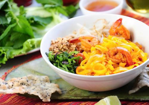 a bowl of food with shrimp and other foods on a table at Nature Boutique Hotel - Nguyen Thi Nghia in Da Lat