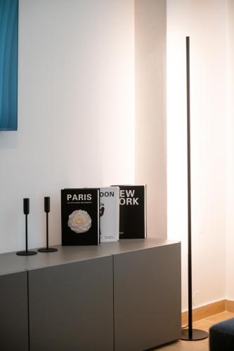 a living room with a table with books on it at VersusArtSuites in Serres