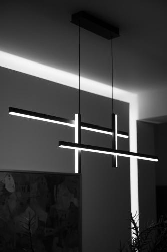 a light hanging from the ceiling in a room at VersusArtSuites in Serres
