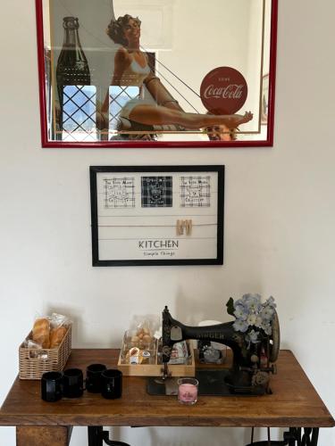 a table with a sewing machine and a mirror at casa monte maggio in Cassino