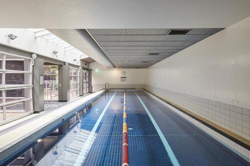 an empty swimming pool in a building at Deco Loft on Russell Street in Melbourne