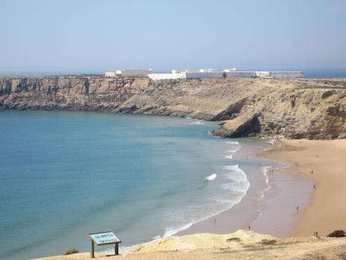 a view of a beach with people on the sand at Aparthotel Navigator in Sagres