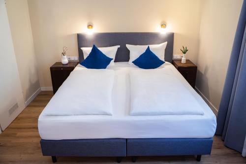 Postel nebo postele na pokoji v ubytování Hotel Altmünchen by Blattl