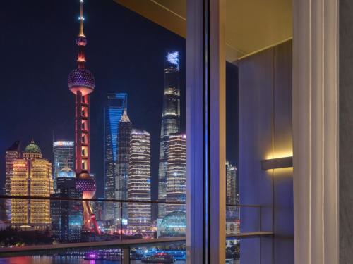 a view of a city skyline at night at Regent Shanghai on the Bund in Shanghai