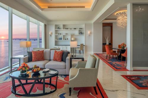 a living room with a couch and a table at Solaire Resort Entertainment City in Manila