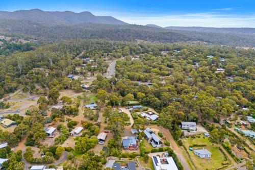 an aerial view of a park with houses and trees at Sea views at Spring Beach Tasmanias East Coast in Spring Beach
