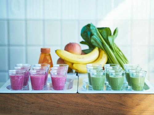 a tray of glasses filled with different colored drinks at Lotte City Hotel Kinshicho in Tokyo