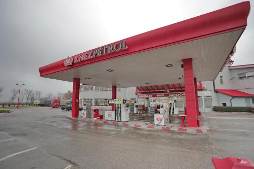 a mobil gas station in a parking lot at Prenociste Knez in Sombor