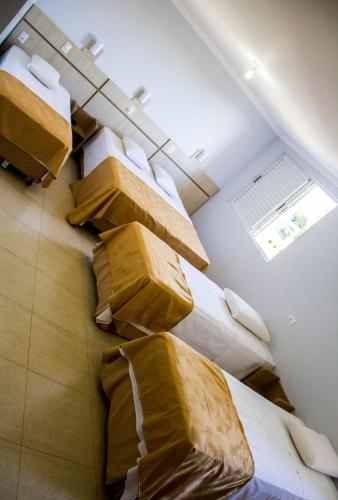 Ένα ή περισσότερα κρεβάτια σε δωμάτιο στο Hotel Baviera Iguassu