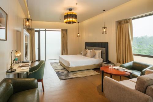 Postel nebo postele na pokoji v ubytování Udman Hotel Greater Noida