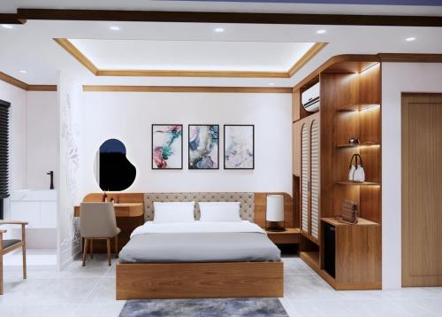 a bedroom with a bed and a desk at Boutique En Hotel Sapa in Sa Pa