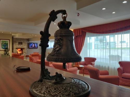 a bell sitting on top of a table at Albergo Conte Max in Capracotta