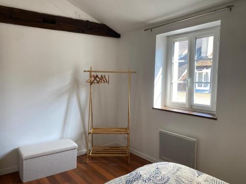 a bedroom with a bed and a window at Sublime appartement en centre-ville d'Evreux in Évreux