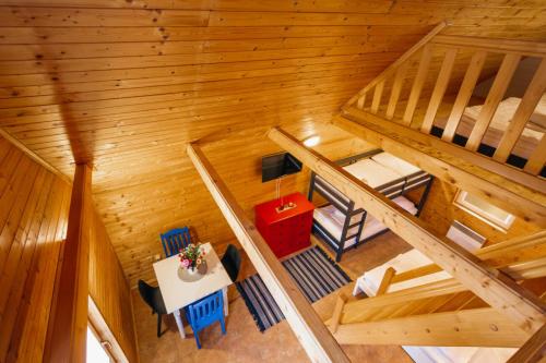 an overhead view of a cabin with a table and chairs at Chalets & Apartments - Base Camp Medvědín in Špindlerův Mlýn