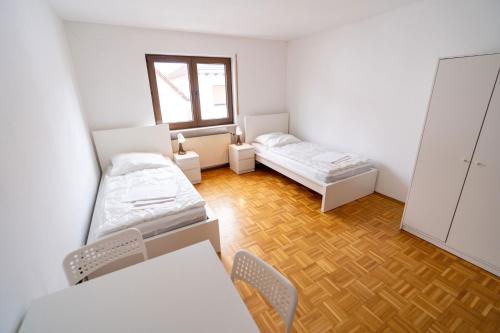 Postel nebo postele na pokoji v ubytování TOP Businesshaus in ruhiger Lage