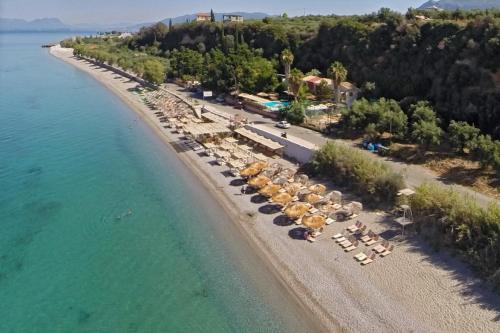 an aerial view of a beach with chairs and umbrellas at Avia Blue Maisonettes - Messinia Gulf Retreat in Avia