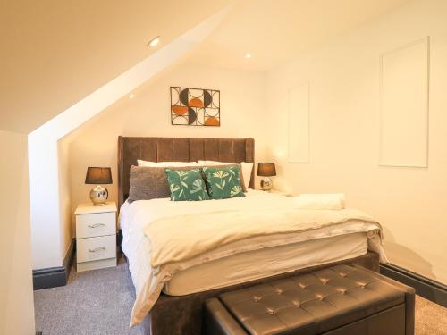 a bedroom with a large bed in a attic at Gwynfa in Barmouth