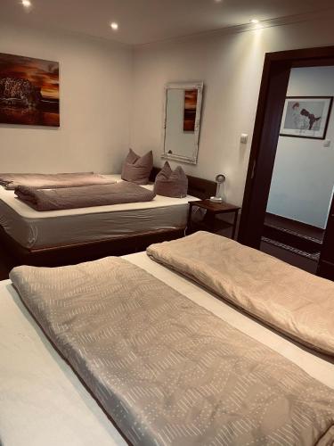 a room with three beds in a room at Appartement Sabrina in Steinberg am Rofan