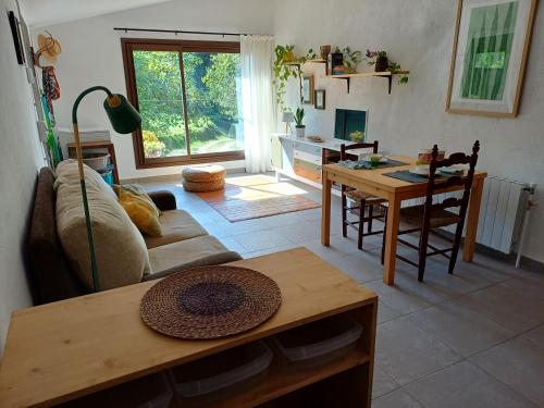 a living room with a couch and a table at Estudi ideal en una masia in Amer