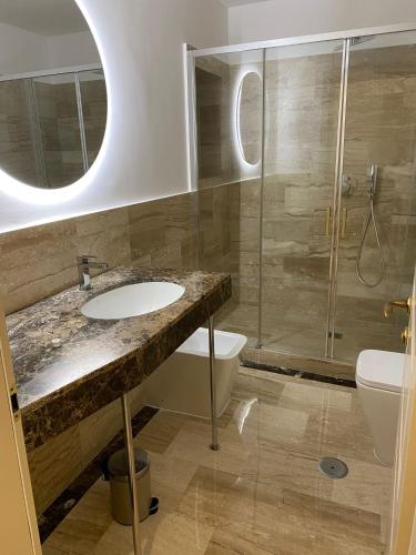 a bathroom with a sink and a shower and a toilet at Cozy Luxury Room Pantheon in Rome