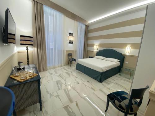 a hotel room with a bed and a table at Cozy Luxury Room Pantheon in Rome