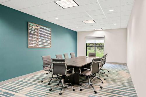 a conference room with a table and chairs at Comfort Inn & Suites Tunkhannock in Tunkhannock