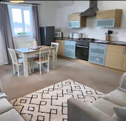 a kitchen with a table and chairs in a room at Beautiful Countryside Cottage Alnwick Northumberland in Alnwick
