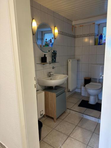 a bathroom with a sink and a toilet at Zentrale Lage zu Köln mitten in der Natur! in Bergisch Gladbach