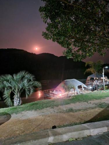a view of a harbor at night with a palm tree at Emahlathini Guest Farm in Piet Retief