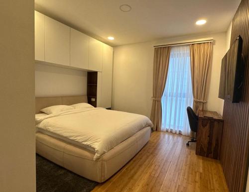 Katil atau katil-katil dalam bilik di Pitesti Residence