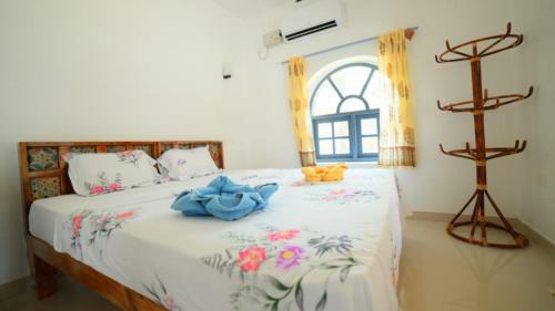 Postel nebo postele na pokoji v ubytování Magnolia Guesthouse Varkala