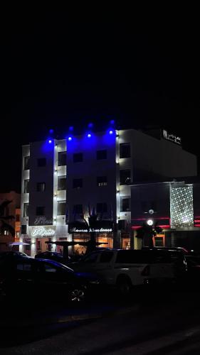 a building with blue lights on it at night at Moussa Residence in Dakhla
