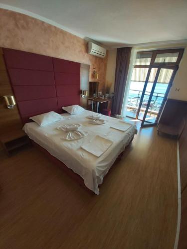 Ένα ή περισσότερα κρεβάτια σε δωμάτιο στο Guest House Skalite