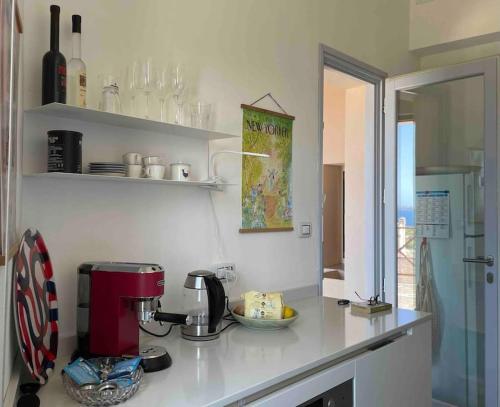 a kitchen with a coffee maker on a counter at Belvedere Diaz in Calasetta