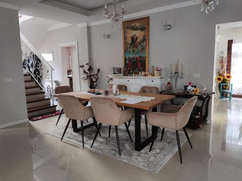 a dining room with a wooden table and chairs at Elegant House in a Small Village in Tur