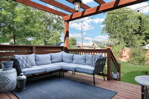 a porch with a couch on a wooden deck at Getaway Near River Walk DT Yard BBQ Pet Games in San Antonio