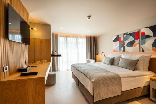 Postel nebo postele na pokoji v ubytování ERK Hotel