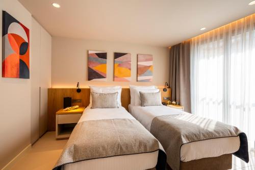 Postel nebo postele na pokoji v ubytování ERK Hotel
